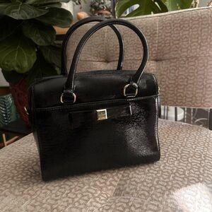 Kate Spade New York Beacon Court Jeanne satchel in black patent leather.